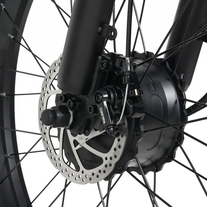 Close-up of a bicycle wheel with disc brake system on a white background