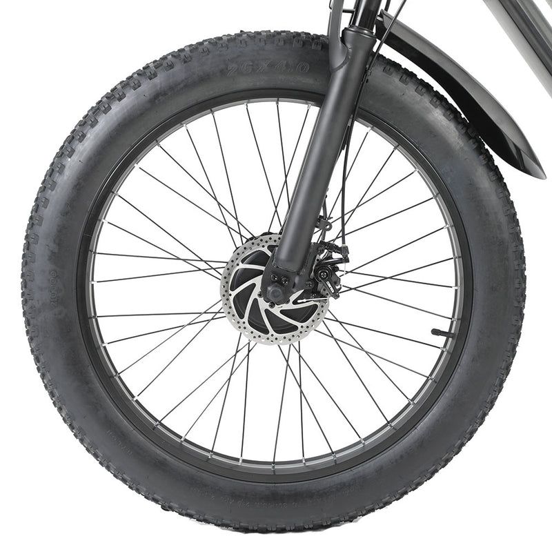 Close-up of a bicycle wheel with thick tire on a white background