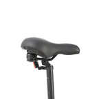 Black bicycle seat with adjustable mechanism on a white background