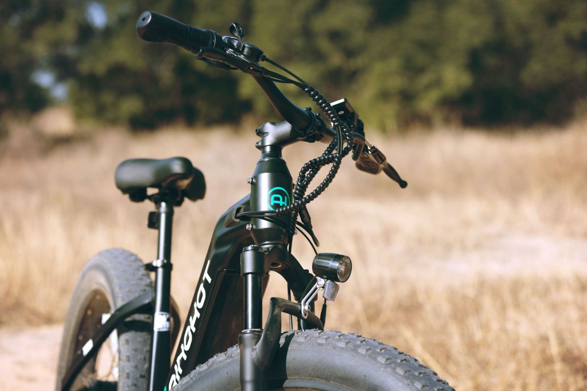 Close-up of a Ainohot bicycle with a blurred natural background